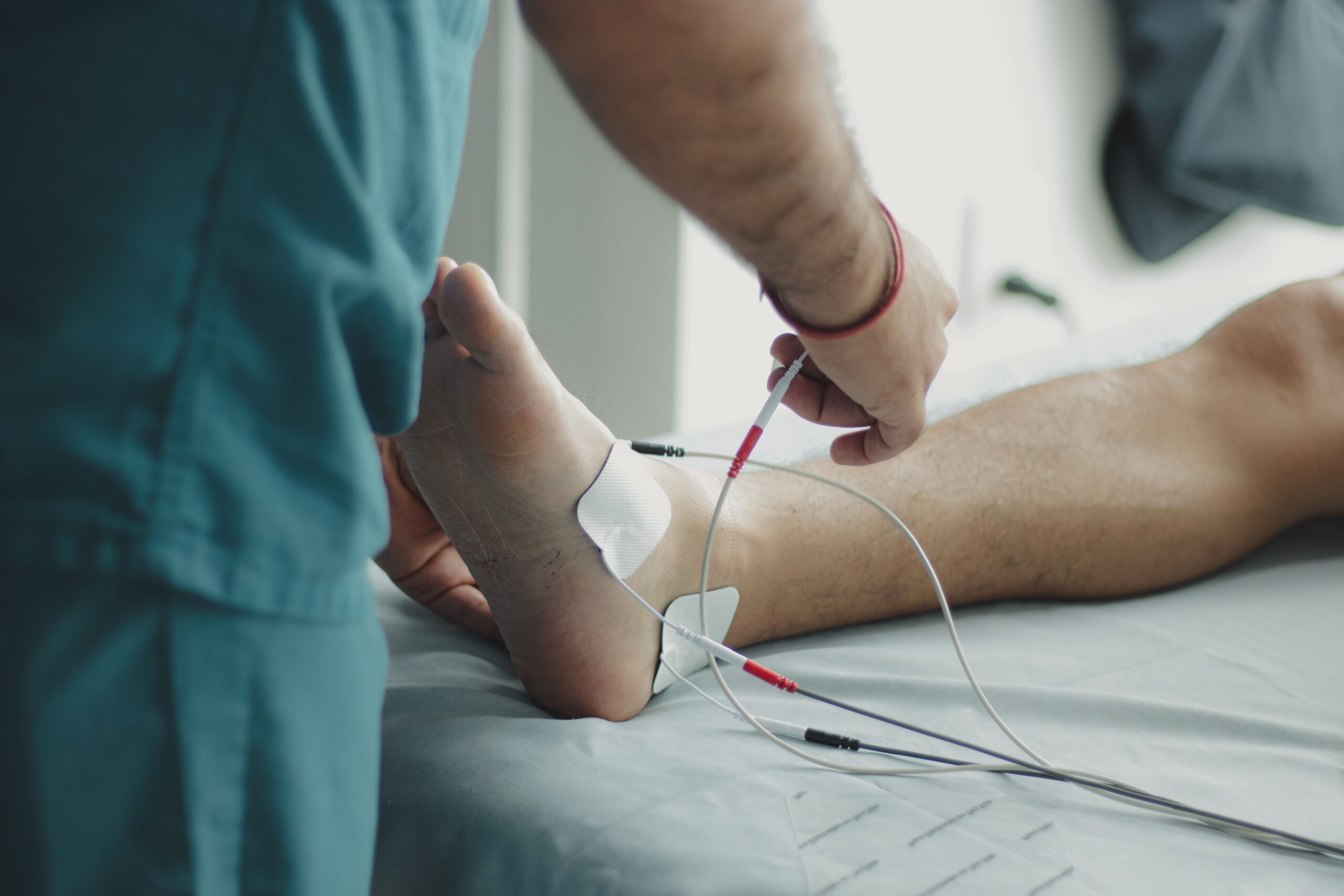 Professional podiatrist providing foot pain treatment in Blackburn clinic