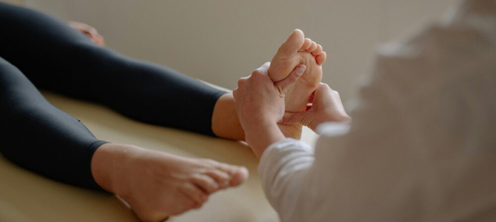 Podiatrist assessing chronic heel pain at a Blackburn clinic