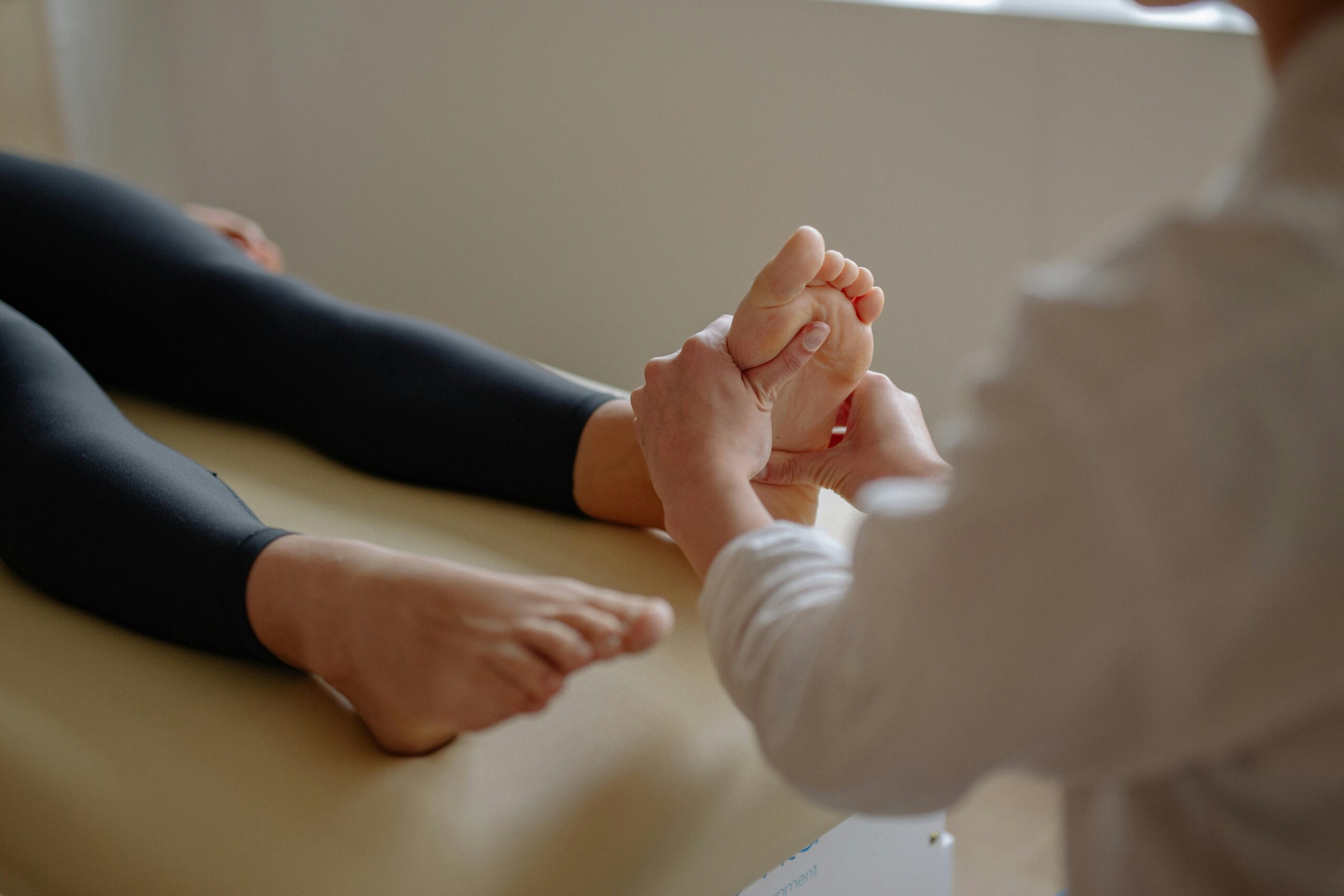Podiatrist assessing chronic heel pain at a Blackburn clinic